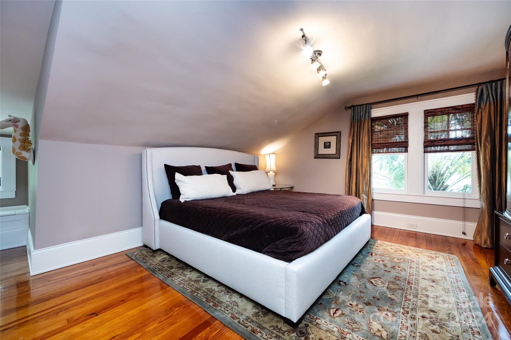 2310 Westfield Road Charlotte, NC 28207 - Photo 28 of 43 a bedroom with a bed and wooden floor