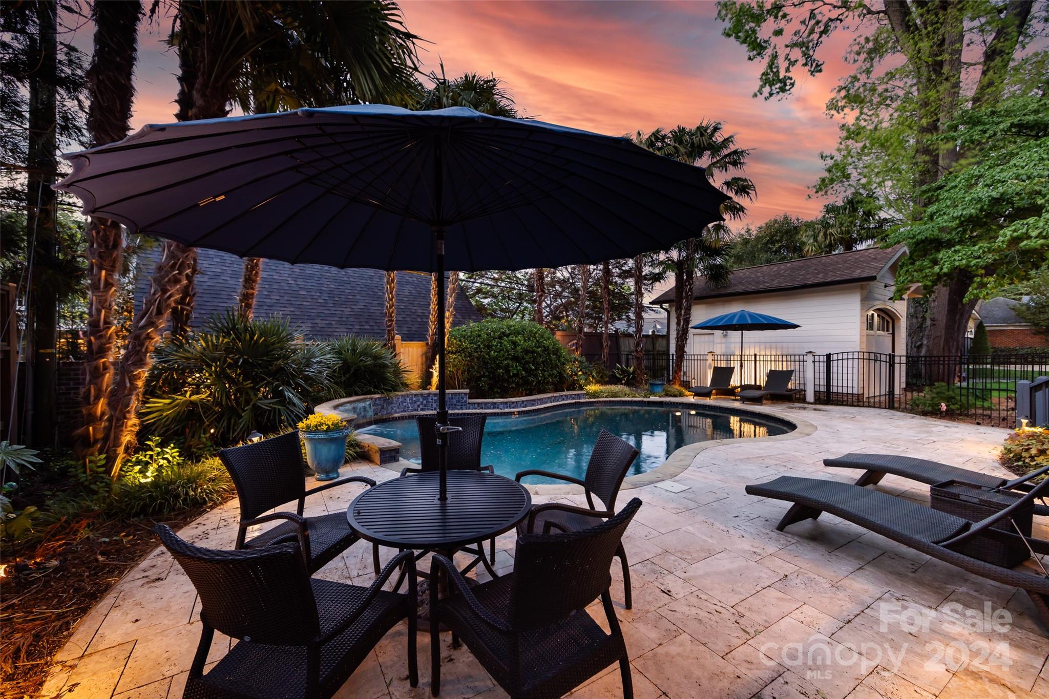2310 Westfield Road Charlotte, NC 28207 - Photo 41 of 43 a view of patio with table and chairs under an umbrella