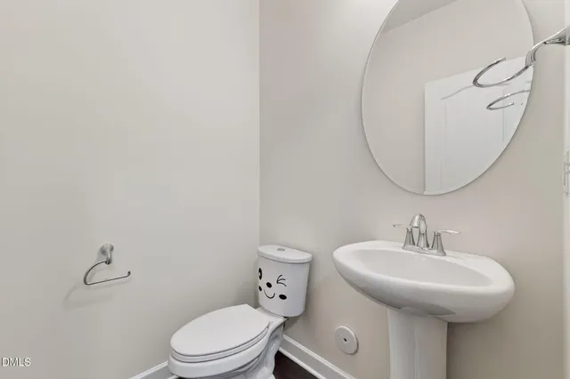 an empty room with wooden floor a ceiling fan and a window