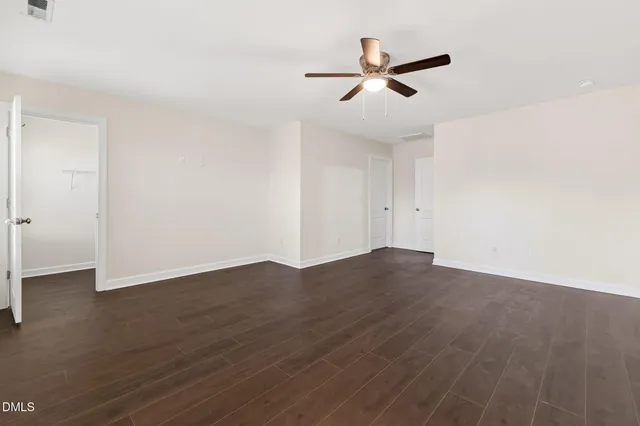 a bathroom with a double vanity sink mirror and shower