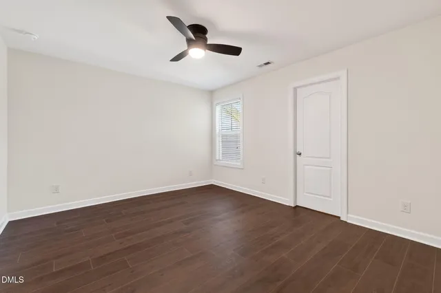 a view of a lake with a flower garden