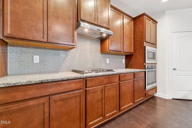 an empty room with wooden floor