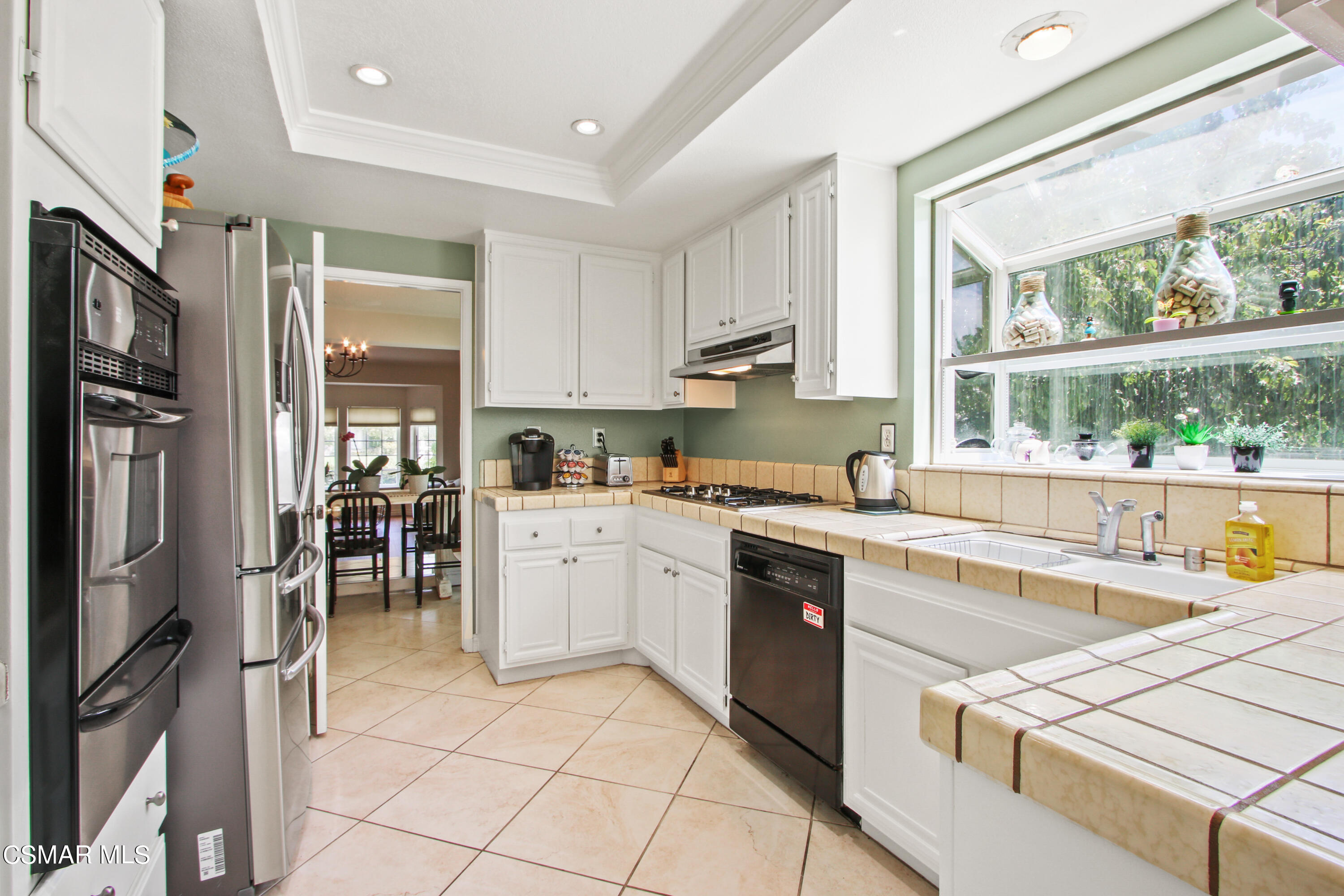 2745 Gum Circle Simi Valley, CA 93065 - Photo 18 of 40 a kitchen with a sink window and stainless steel appliances