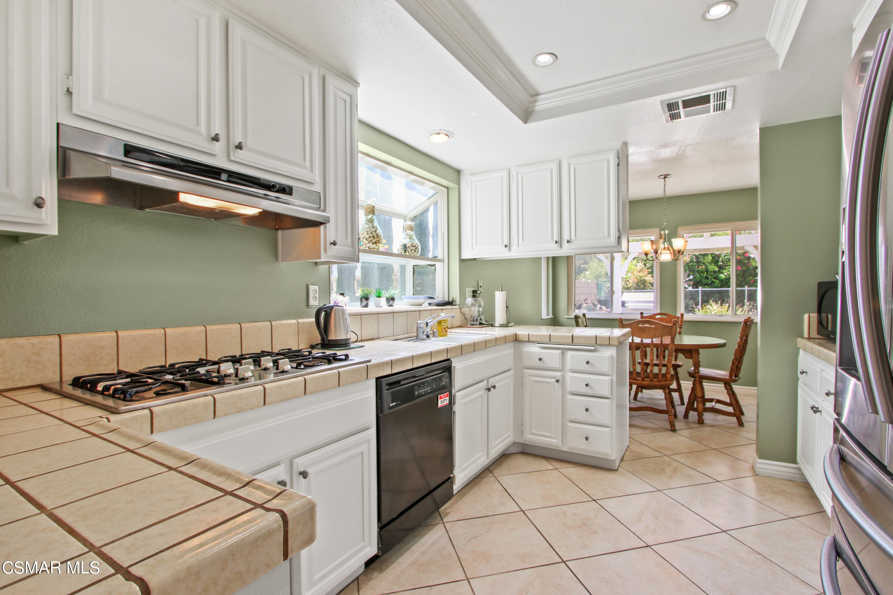 2745 Gum Circle Simi Valley, CA 93065 - Photo 20 of 40 a kitchen with cabinets and chairs
