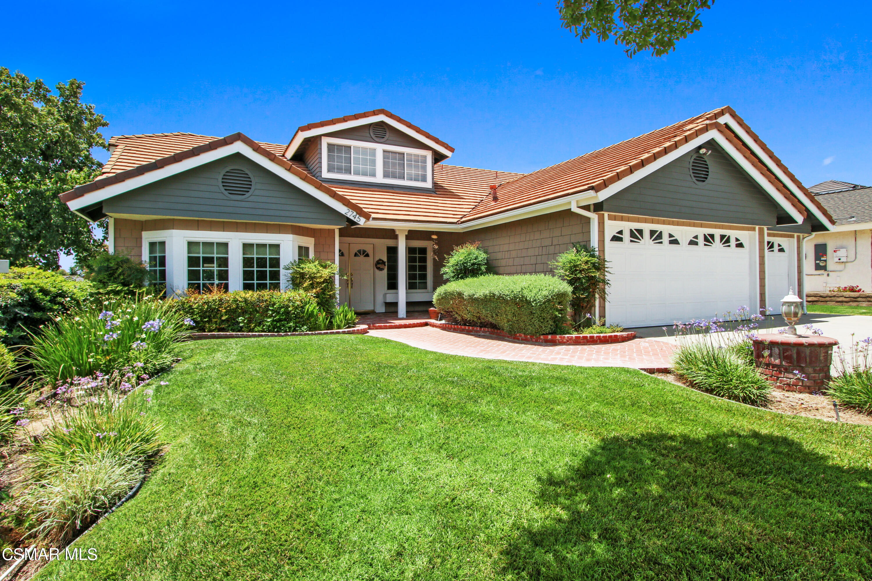 2745 Gum Circle Simi Valley, CA 93065 - Photo 2 of 40 a front view of a house with a yard