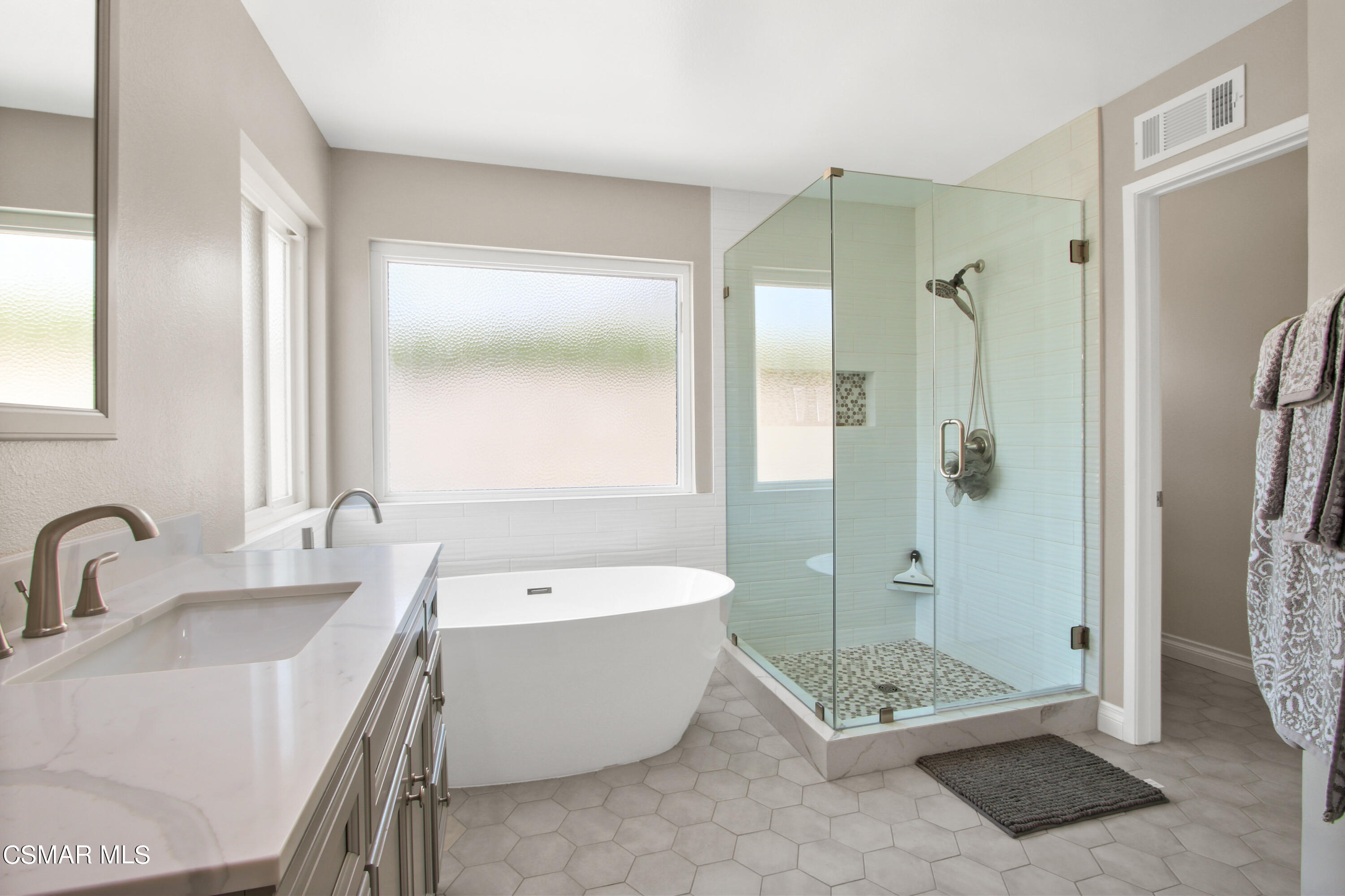 2745 Gum Circle Simi Valley, CA 93065 - Photo 23 of 40 a bathroom with a tub shower sink and mirror