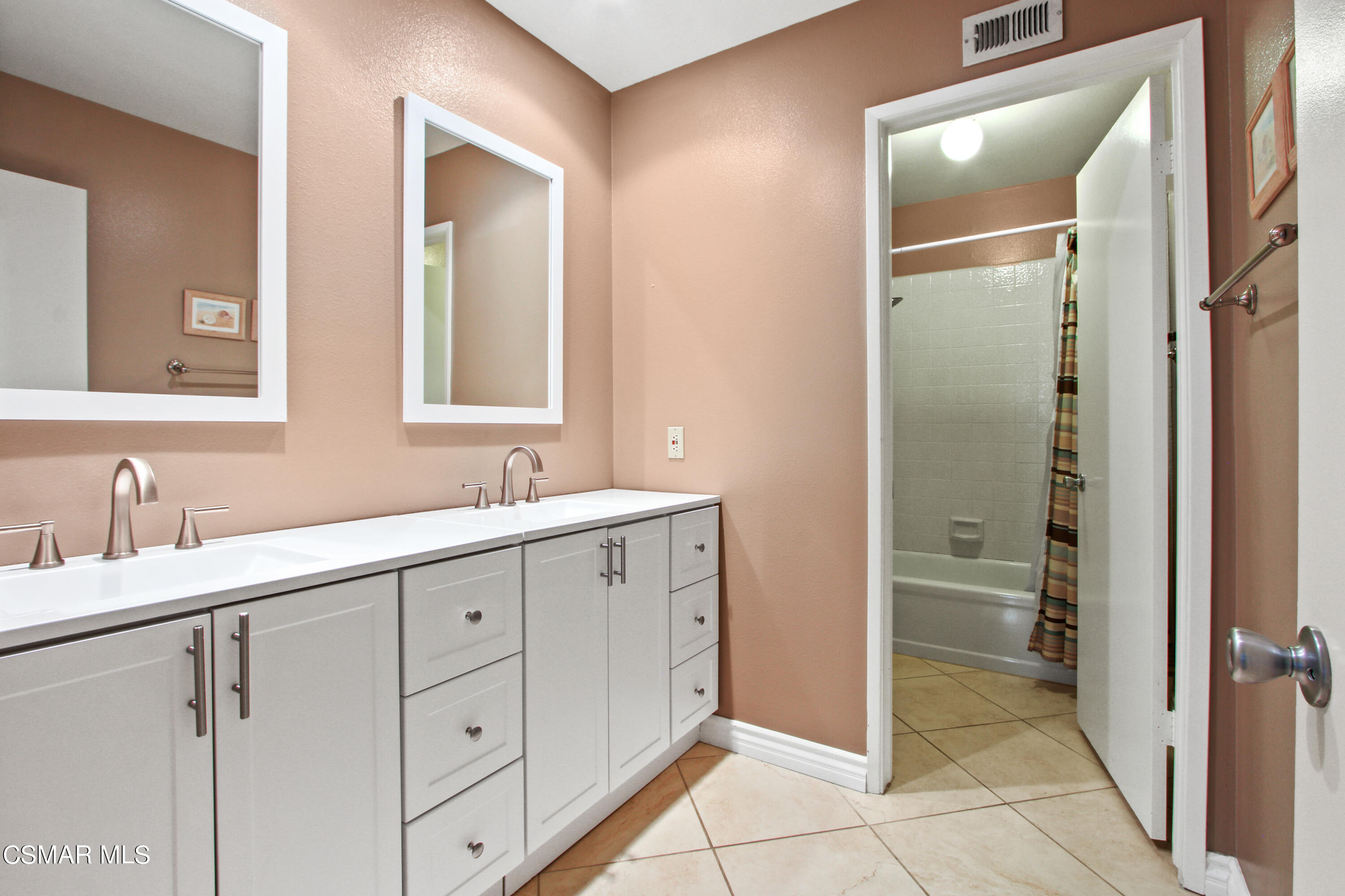 2745 Gum Circle Simi Valley, CA 93065 - Photo 25 of 40 a spacious bathroom with a double vanity sink mirror and a