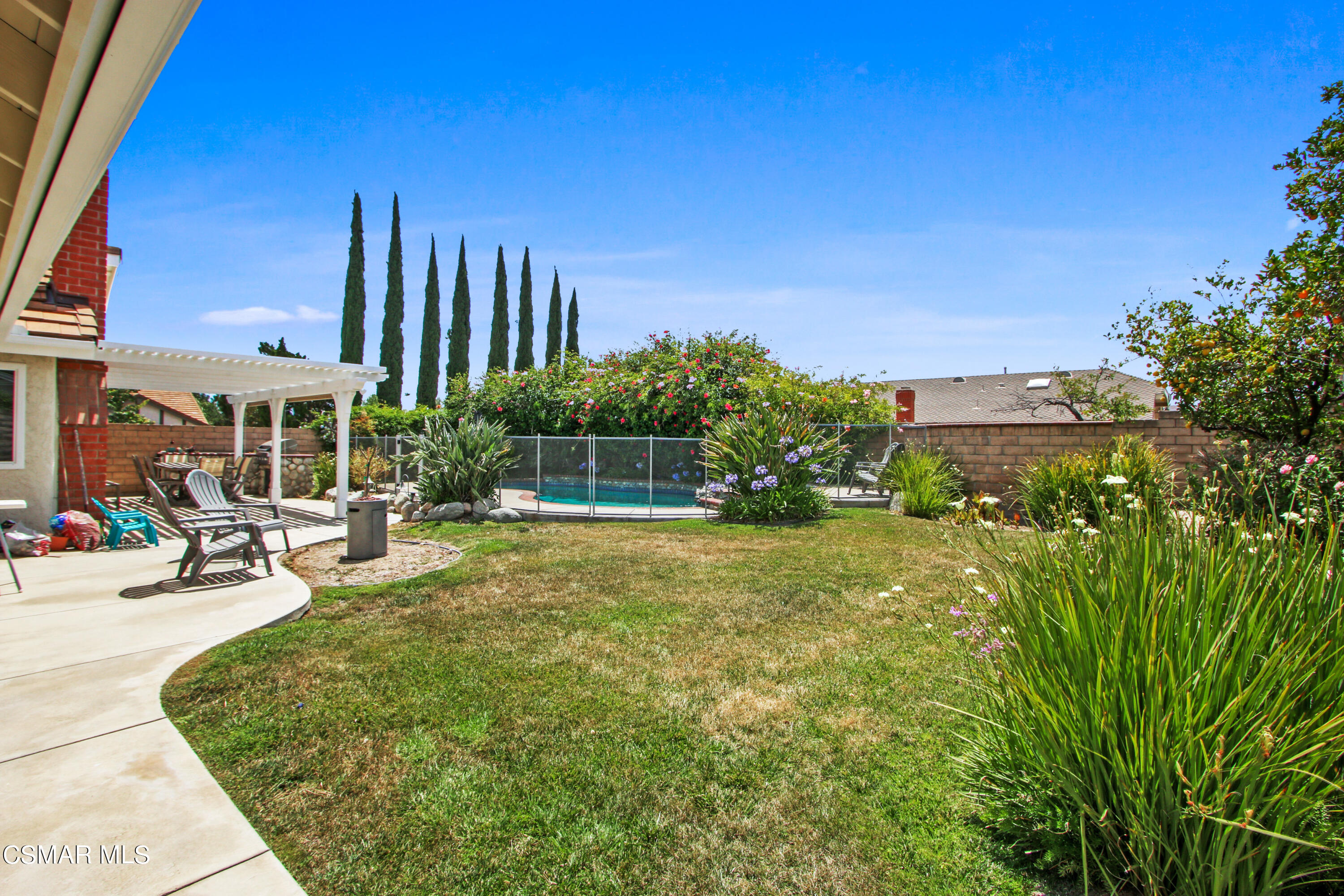 2745 Gum Circle Simi Valley, CA 93065 - Photo 39 of 40 a view of a swimming pool with sitting area and garden
