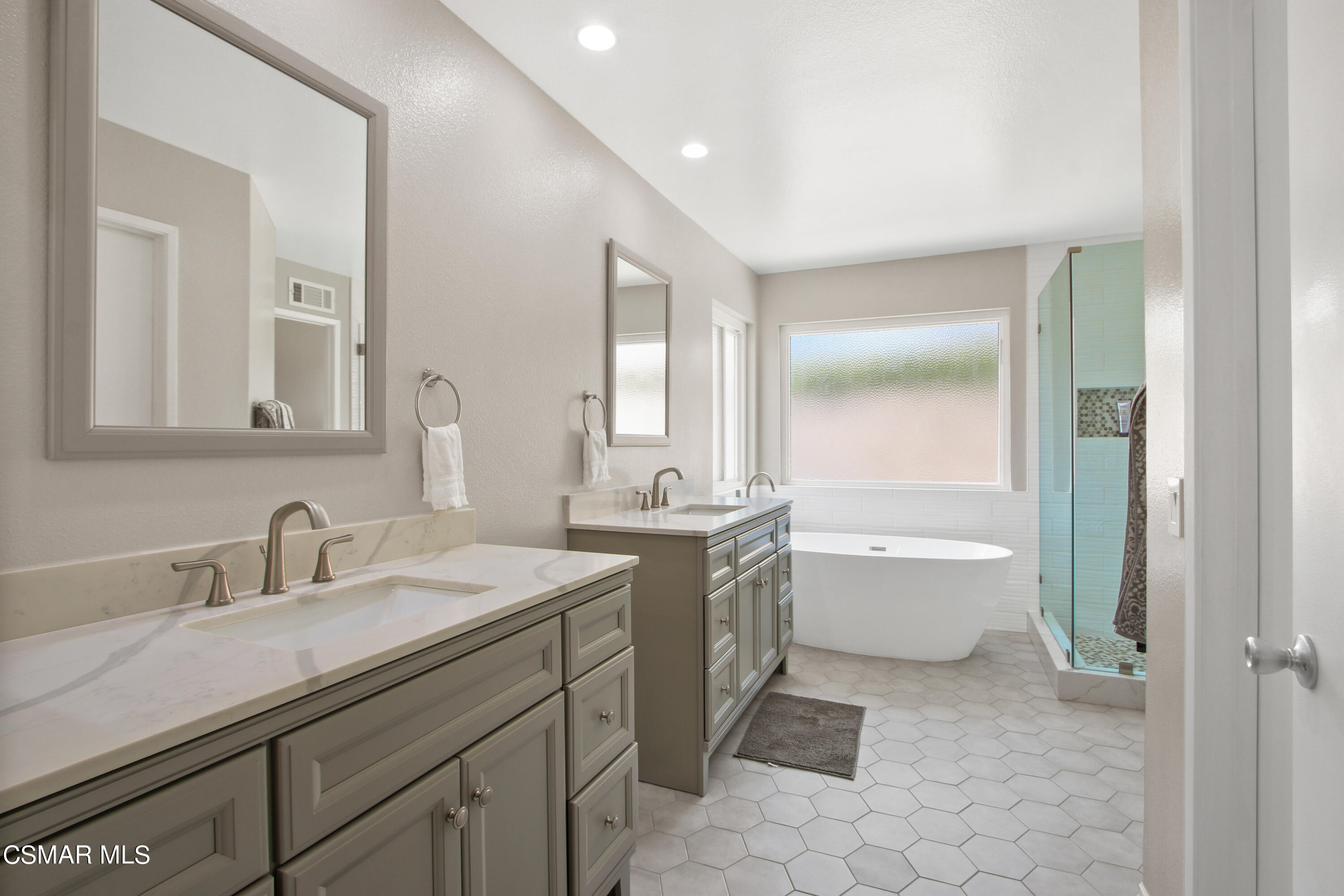 2745 Gum Circle Simi Valley, CA 93065 - Photo 4 of 40 a bathroom with a tub sink and mirror