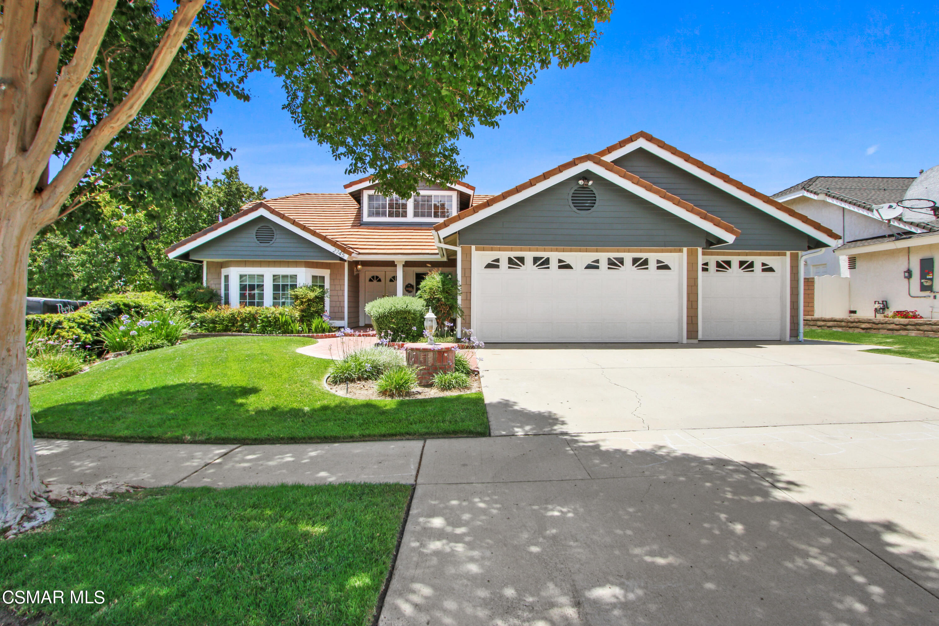 2745 Gum Circle Simi Valley, CA 93065 - Photo 6 of 40 a front view of a house with a garden