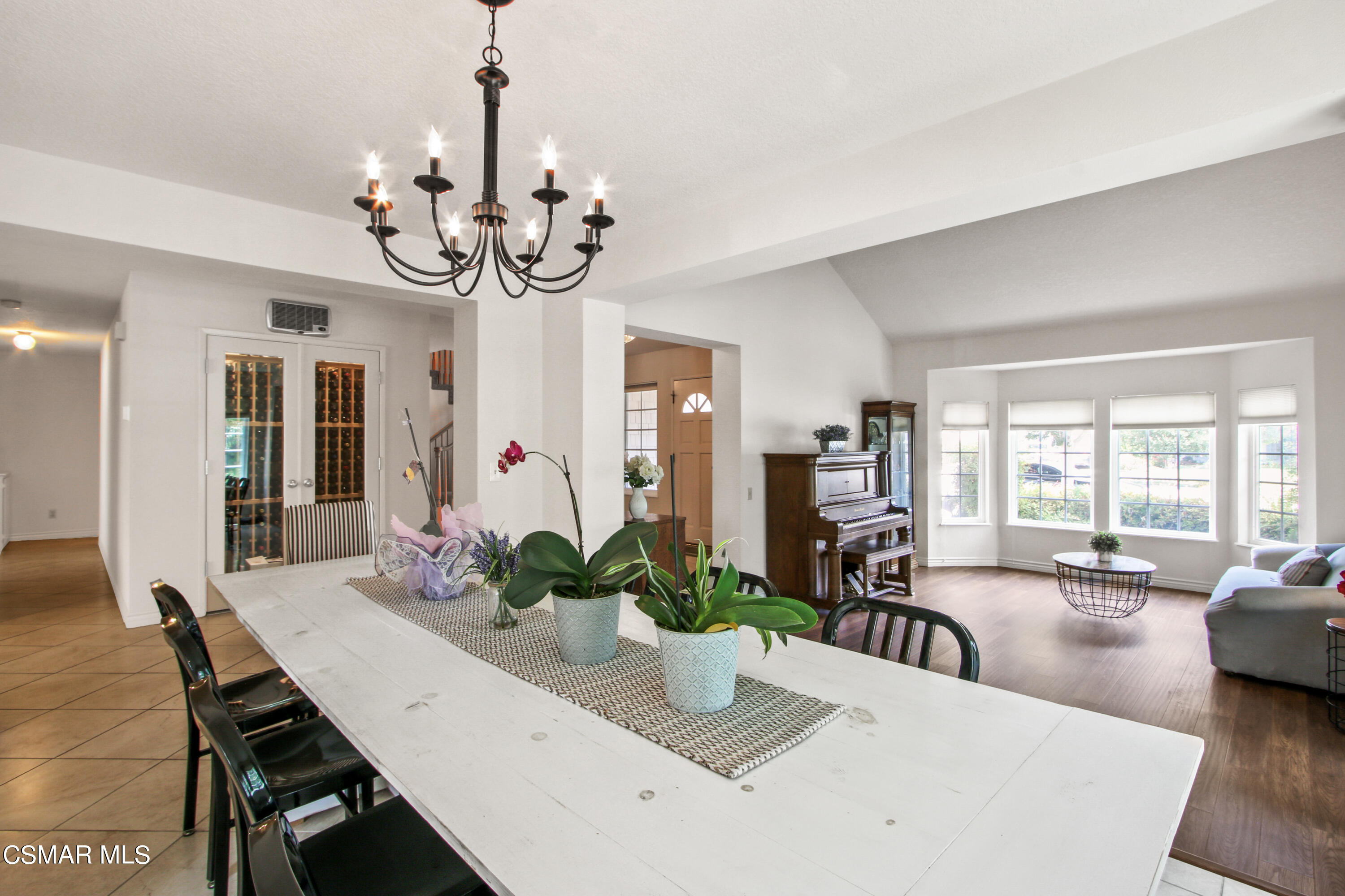 2745 Gum Circle Simi Valley, CA 93065 - Photo 10 of 40 a dining room with furniture potted plants and wooden floor