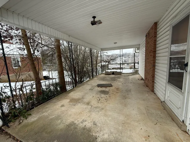 a view of a porch with furniture
