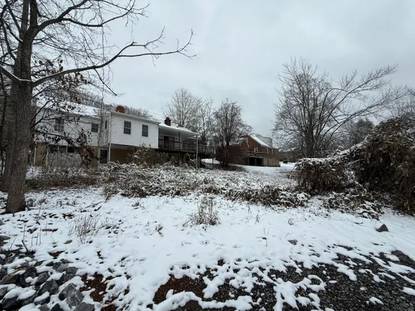 a view of a yard covered in snow