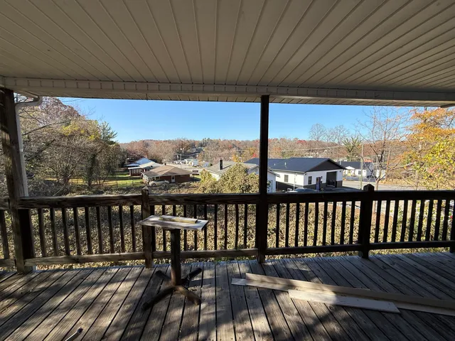 a view of a two chairs in the balcony