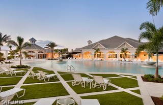 20784 Corkscrew Shores Boulevard Estero, FL 33928 - Photo 4 of 4 a view of a swimming pool with outdoor seating and plants