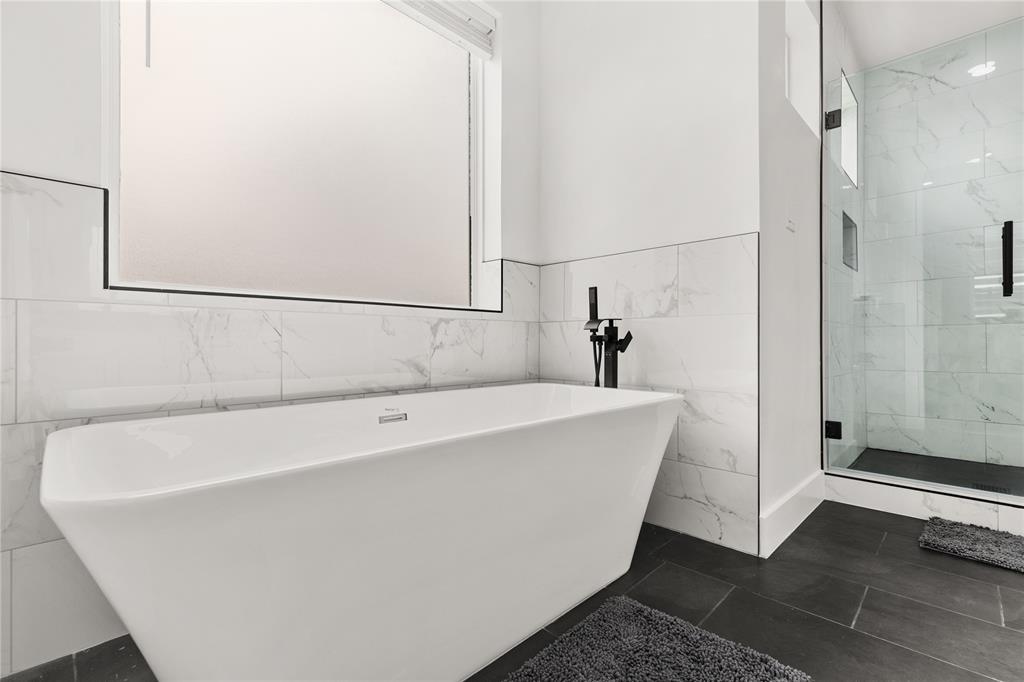 a white bath tub sitting in a bathroom