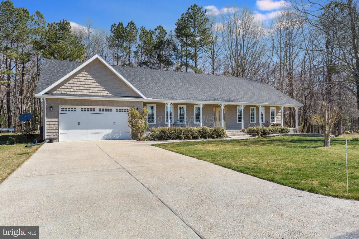 8639 Tindley Road Newark, MD 21841 - Photo 1 of 36 a front view of a house with a yard and garage
