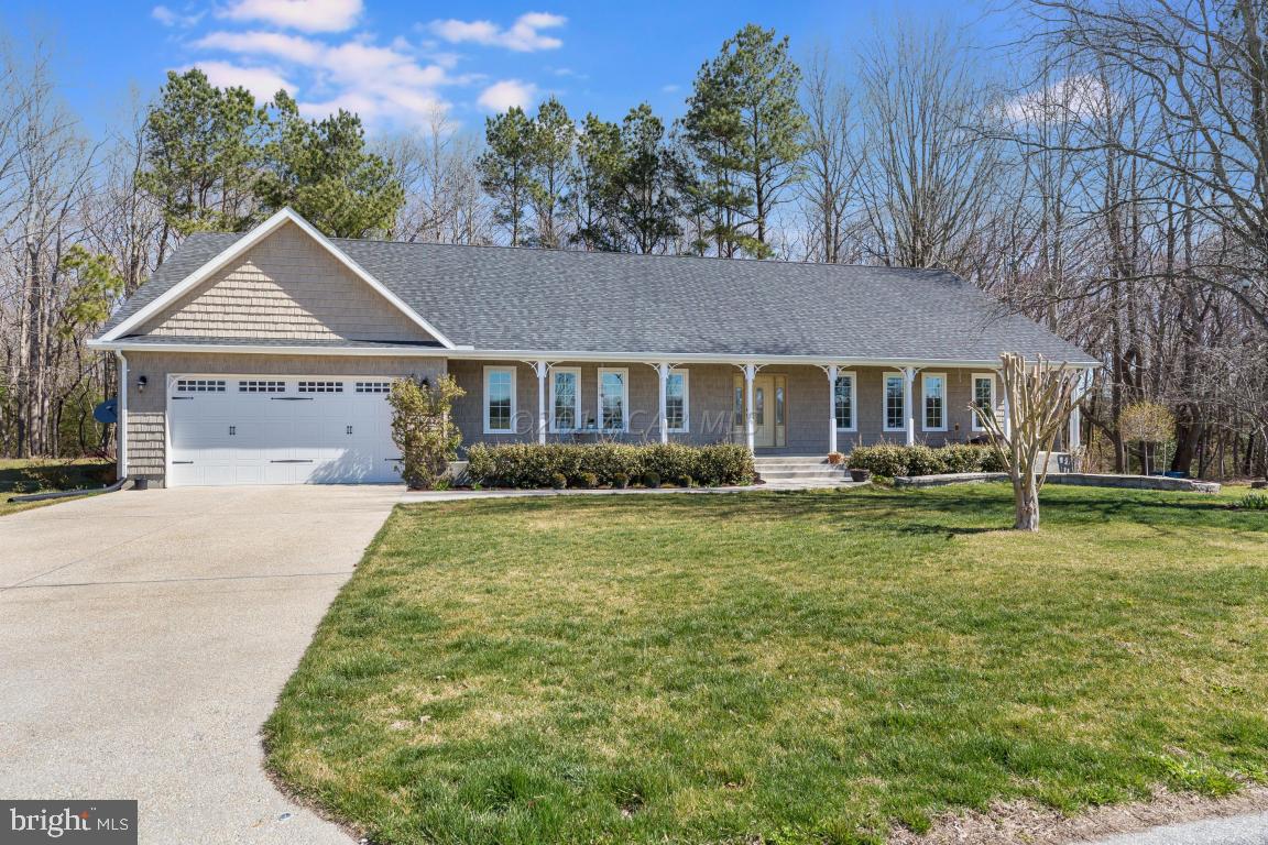 8639 Tindley Road Newark, MD 21841 - Photo 5 of 36 a front view of a house with a yard