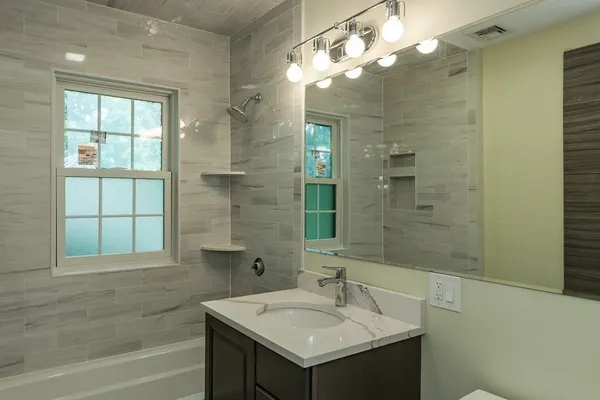 a bathroom with a sink and a mirror