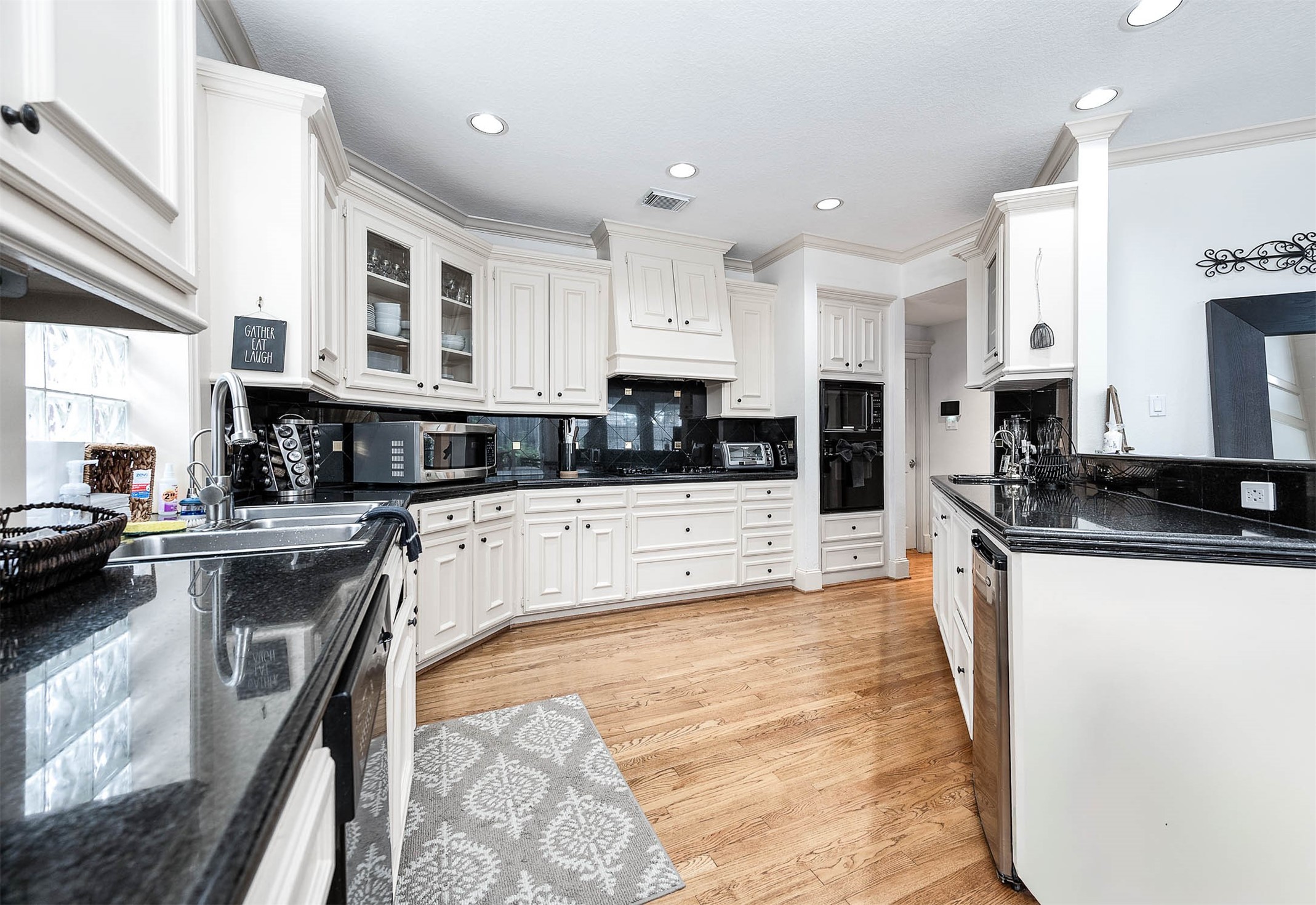 7110 Gary Street Houston, TX 77055 - Photo 13 of 50 a large kitchen with stainless steel appliances granite countertop a stove a sink a oven and a granite counter tops