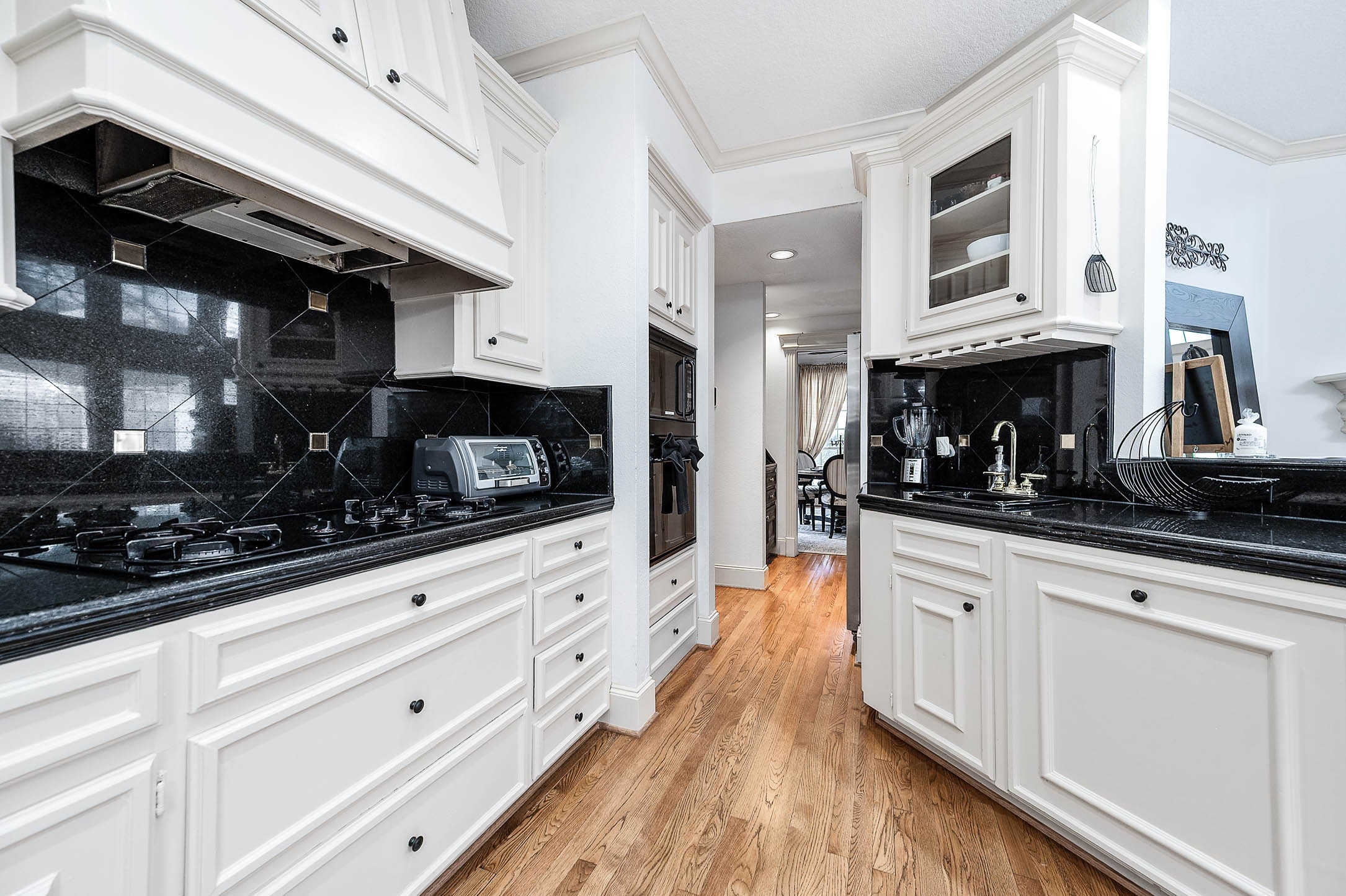 7110 Gary Street Houston, TX 77055 - Photo 15 of 50 a kitchen with stainless steel appliances kitchen island granite countertop a sink and cabinets