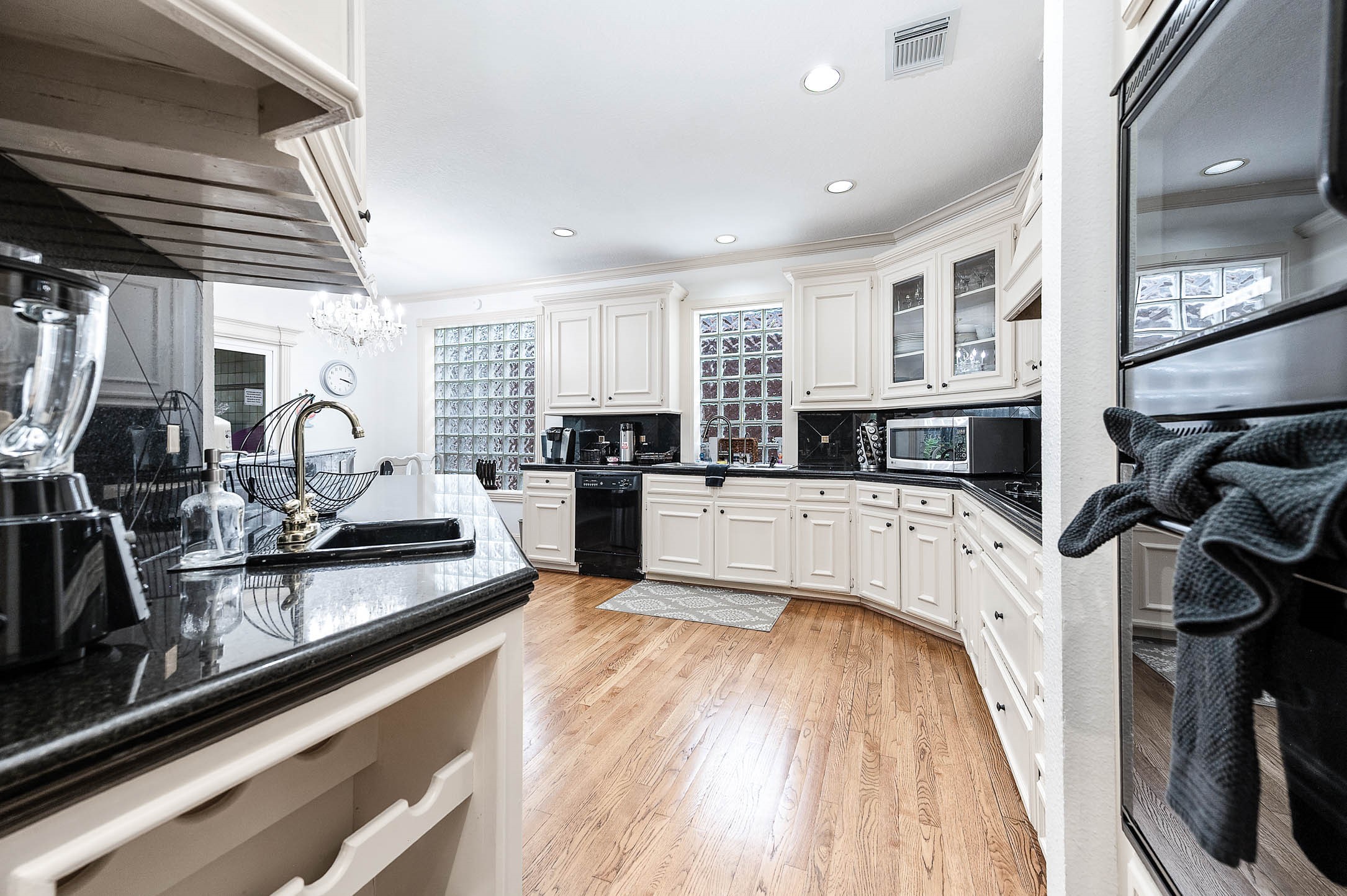 7110 Gary Street Houston, TX 77055 - Photo 16 of 50 a view of a kitchen with microwave and cabinets