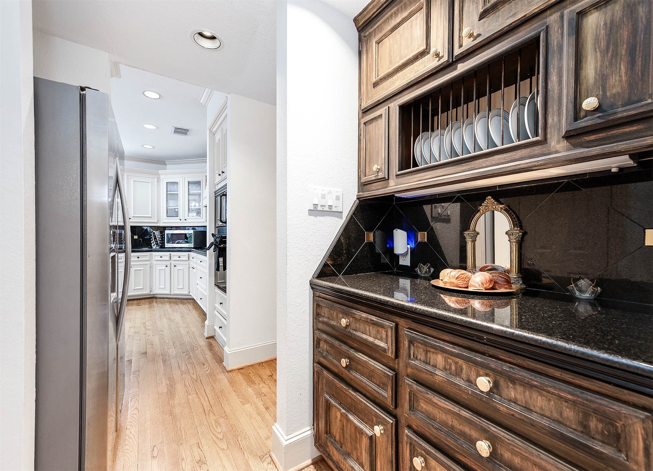 7110 Gary Street Houston, TX 77055 - Photo 17 of 50 a kitchen view with granite countertop a refrigerator and a stove