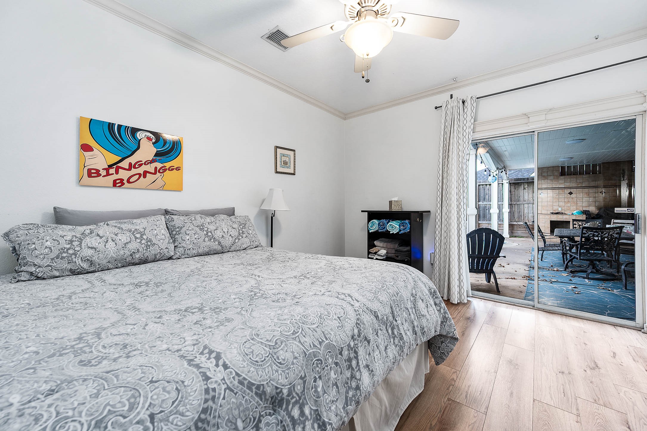 7110 Gary Street Houston, TX 77055 - Photo 19 of 50 a bedroom with a large bed and a chandelier