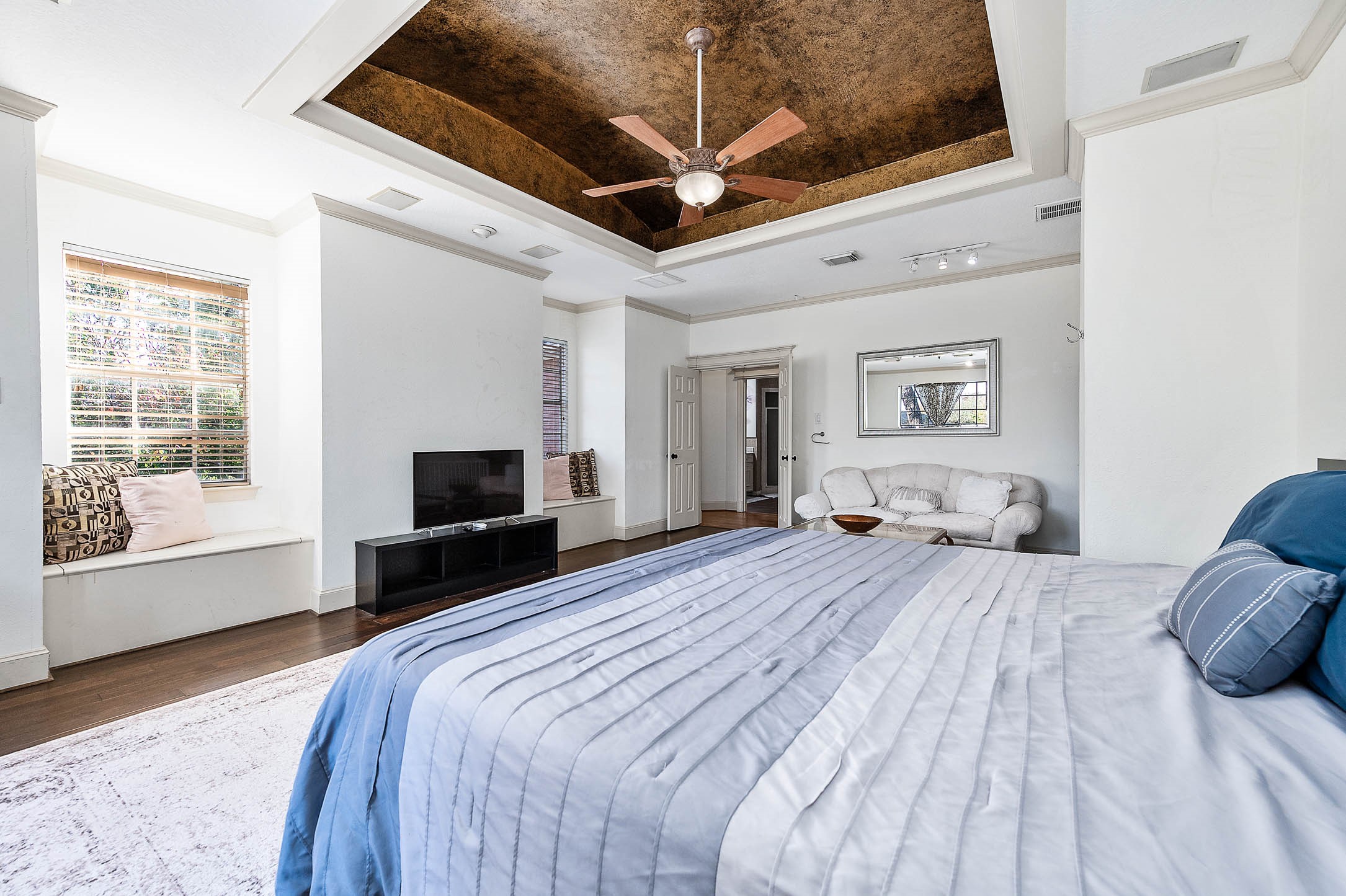 7110 Gary Street Houston, TX 77055 - Photo 30 of 50 a bedroom with a bed and a flat screen tv