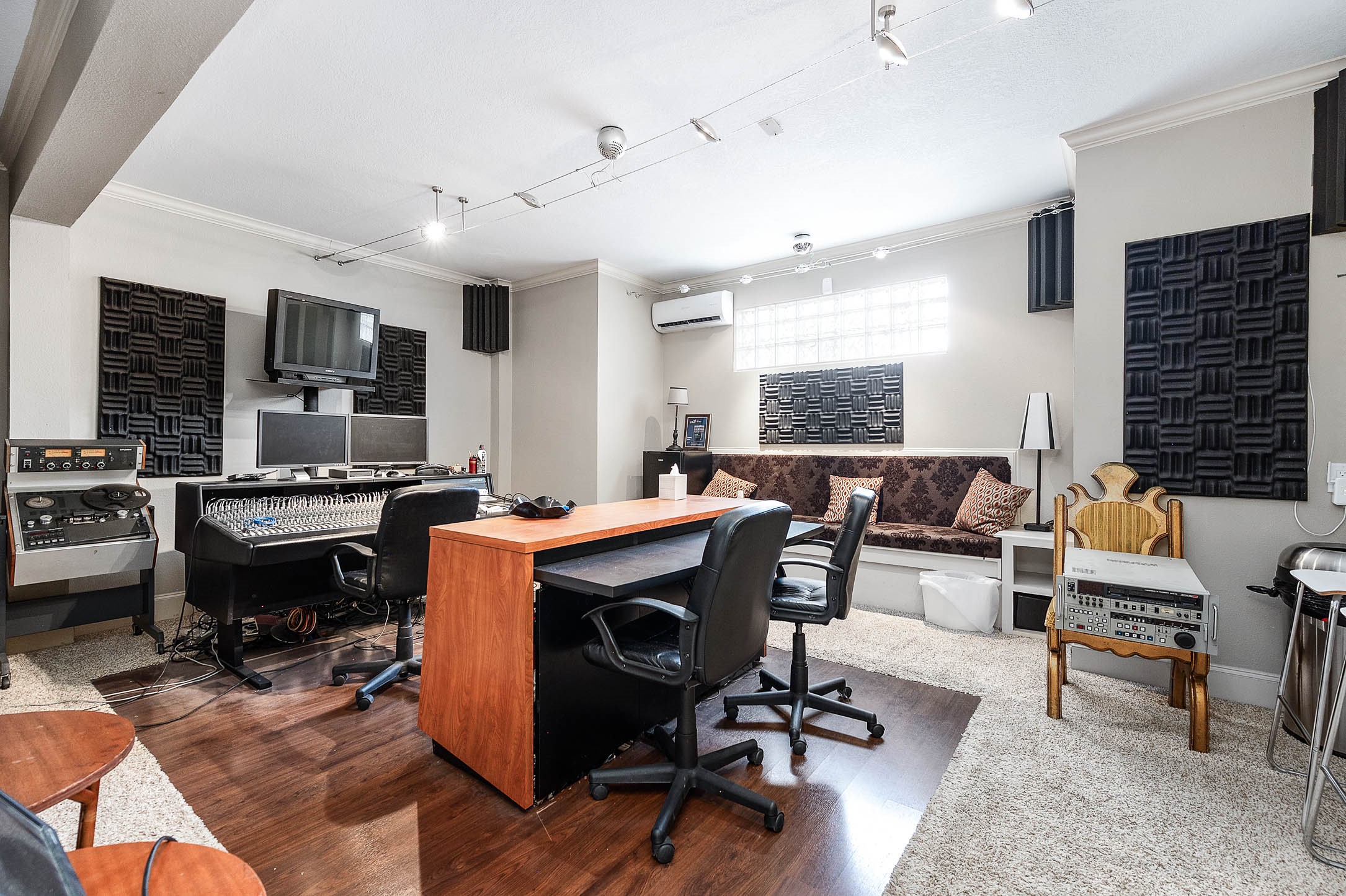 7110 Gary Street Houston, TX 77055 - Photo 32 of 50 a living room with furniture kitchen view and a fireplace
