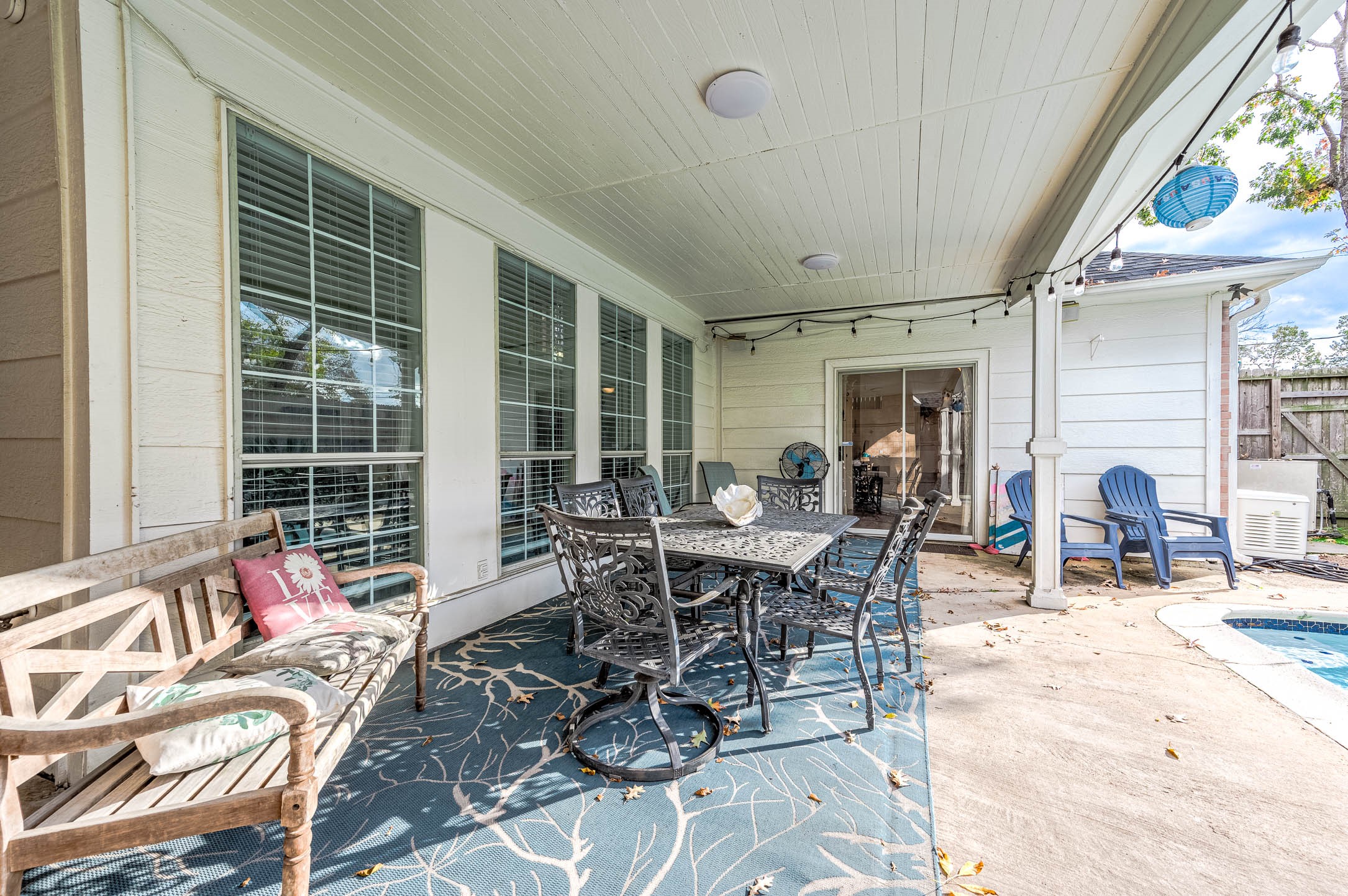7110 Gary Street Houston, TX 77055 - Photo 38 of 50 a view of a dining room and livingroom with furniture wooden floor and a large window