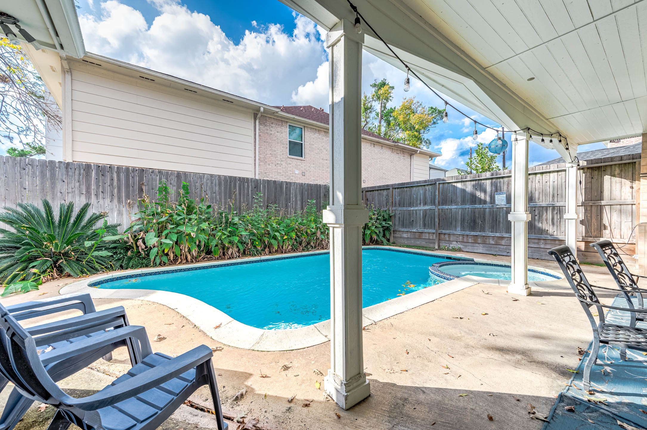 7110 Gary Street Houston, TX 77055 - Photo 39 of 50 a view of a patio with table and chairs potted plants with wooden floor