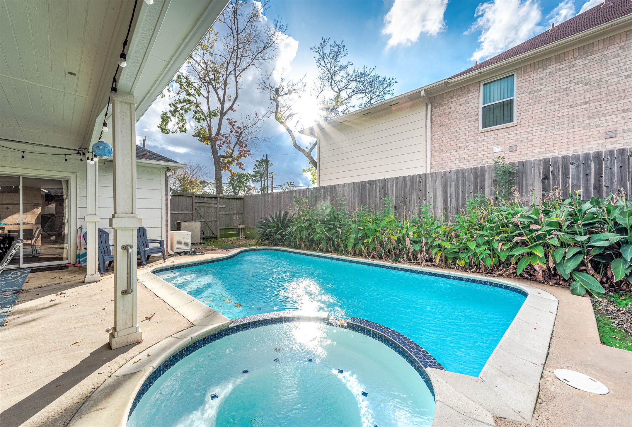 7110 Gary Street Houston, TX 77055 - Photo 40 of 50 a view of a swimming pool with an outdoor seating