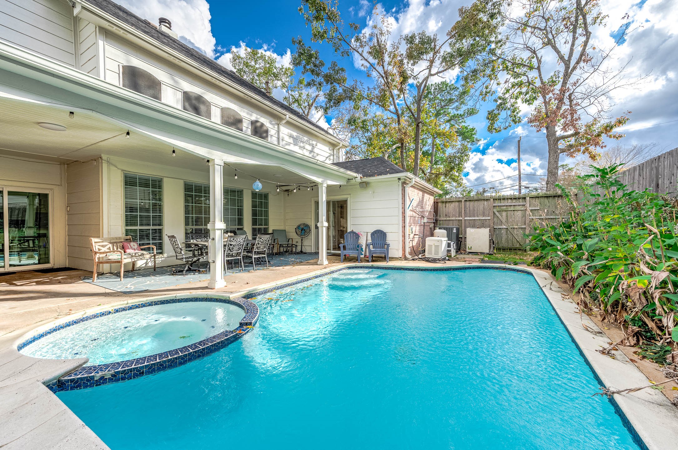 7110 Gary Street Houston, TX 77055 - Photo 41 of 50 a view of a house with swimming pool and sitting area