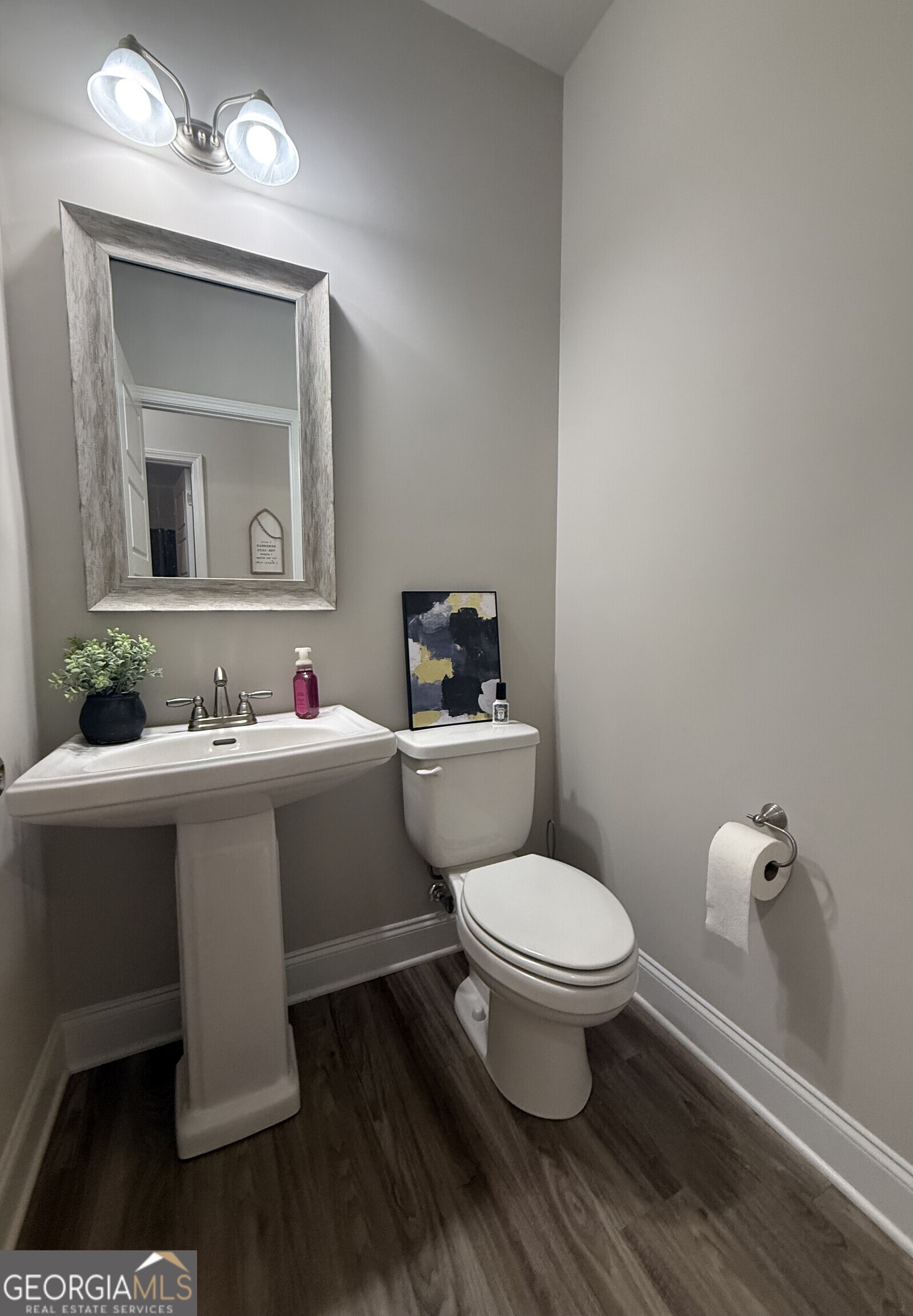 136 Pebble Lane Harlem, GA 30814 - Photo 13 of 30 a bathroom with a sink toilet mirror and vanity