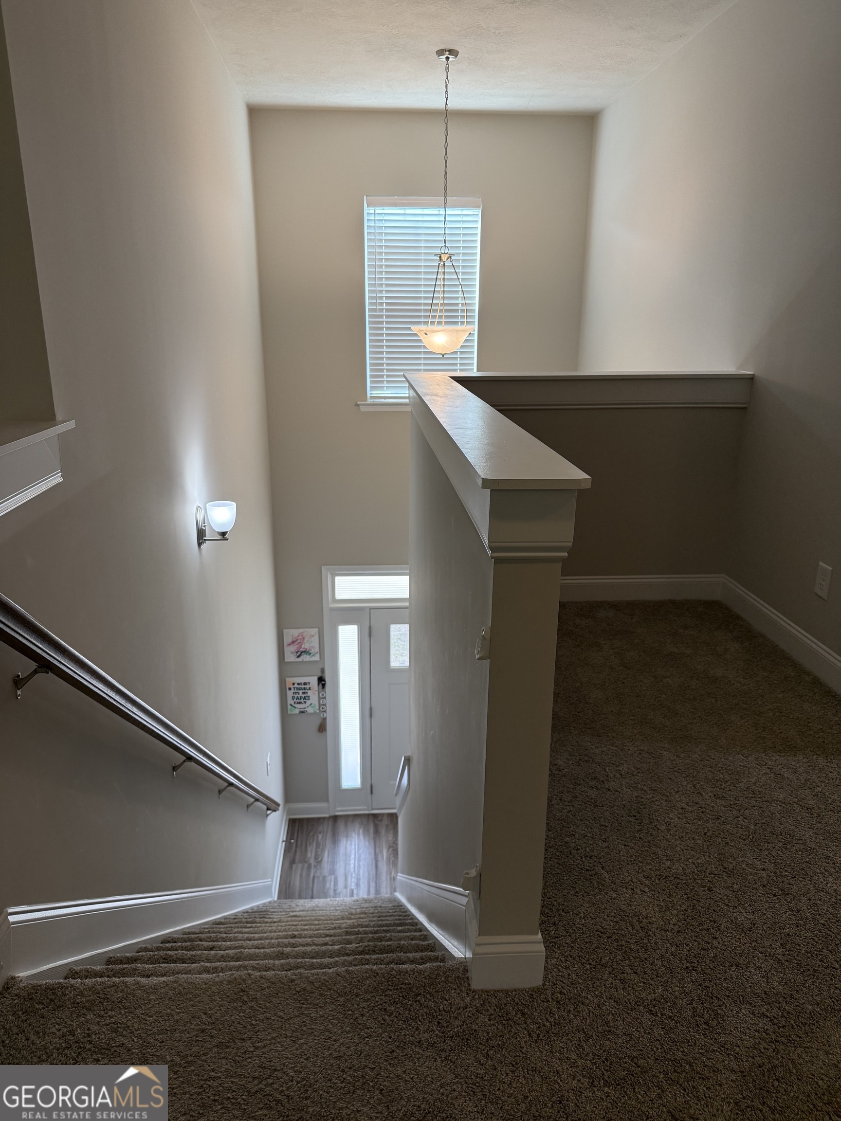 136 Pebble Lane Harlem, GA 30814 - Photo 14 of 30 a view of an empty room with wooden floor and a window