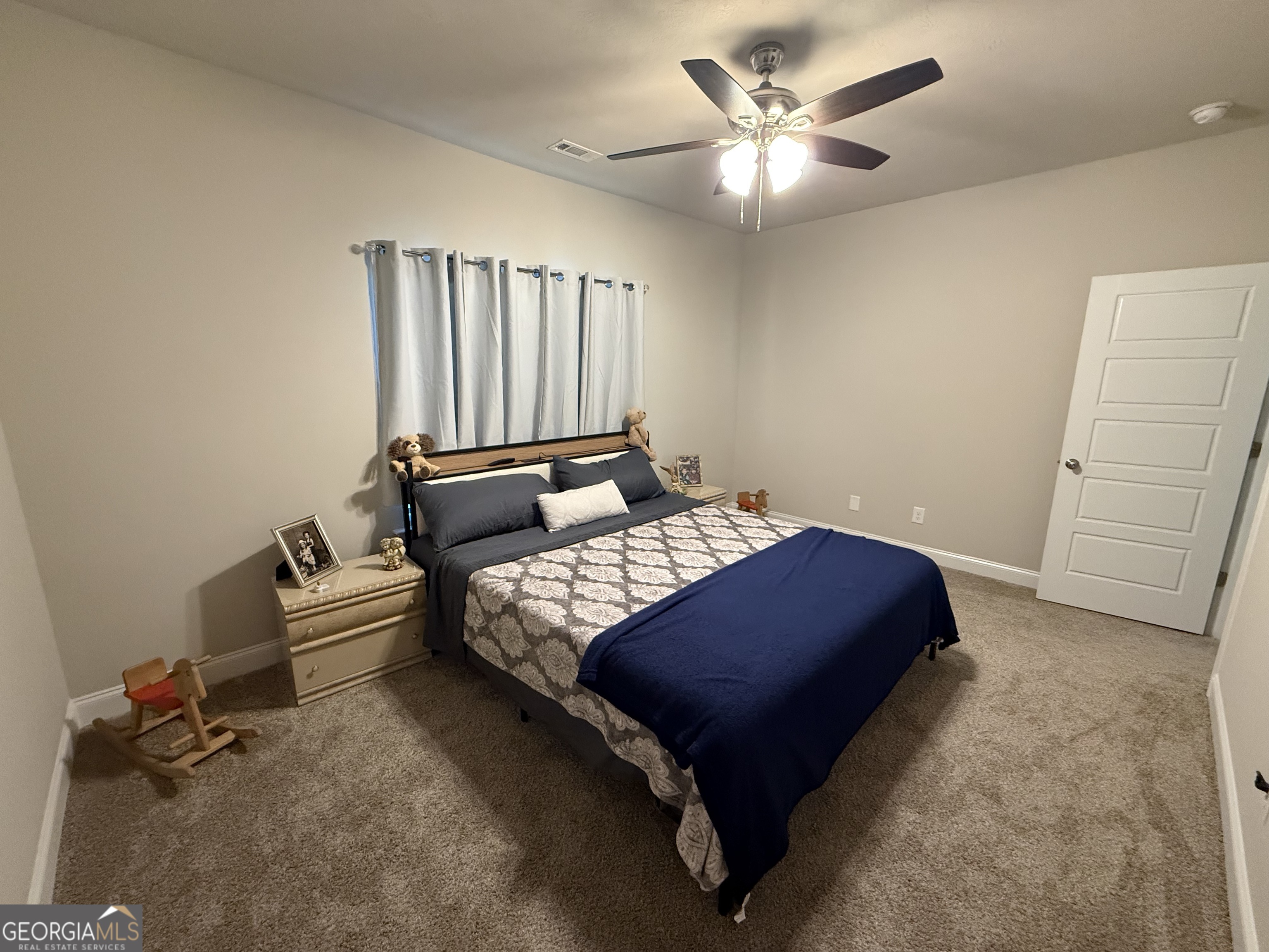 136 Pebble Lane Harlem, GA 30814 - Photo 24 of 30 a bedroom with a bed and window