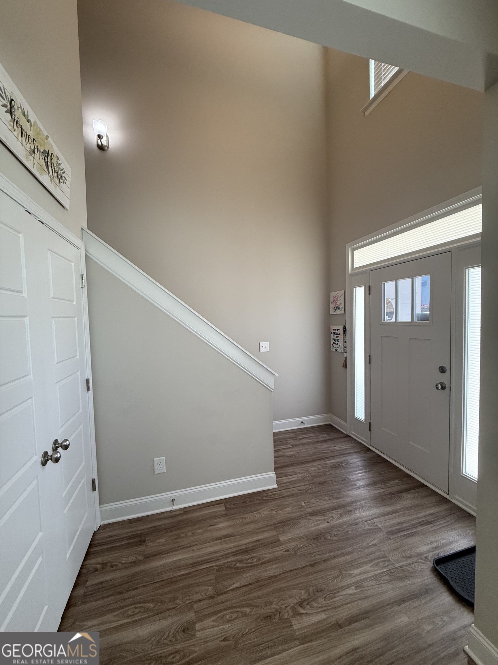136 Pebble Lane Harlem, GA 30814 - Photo 3 of 30 a view of an empty room with wooden floor and a window