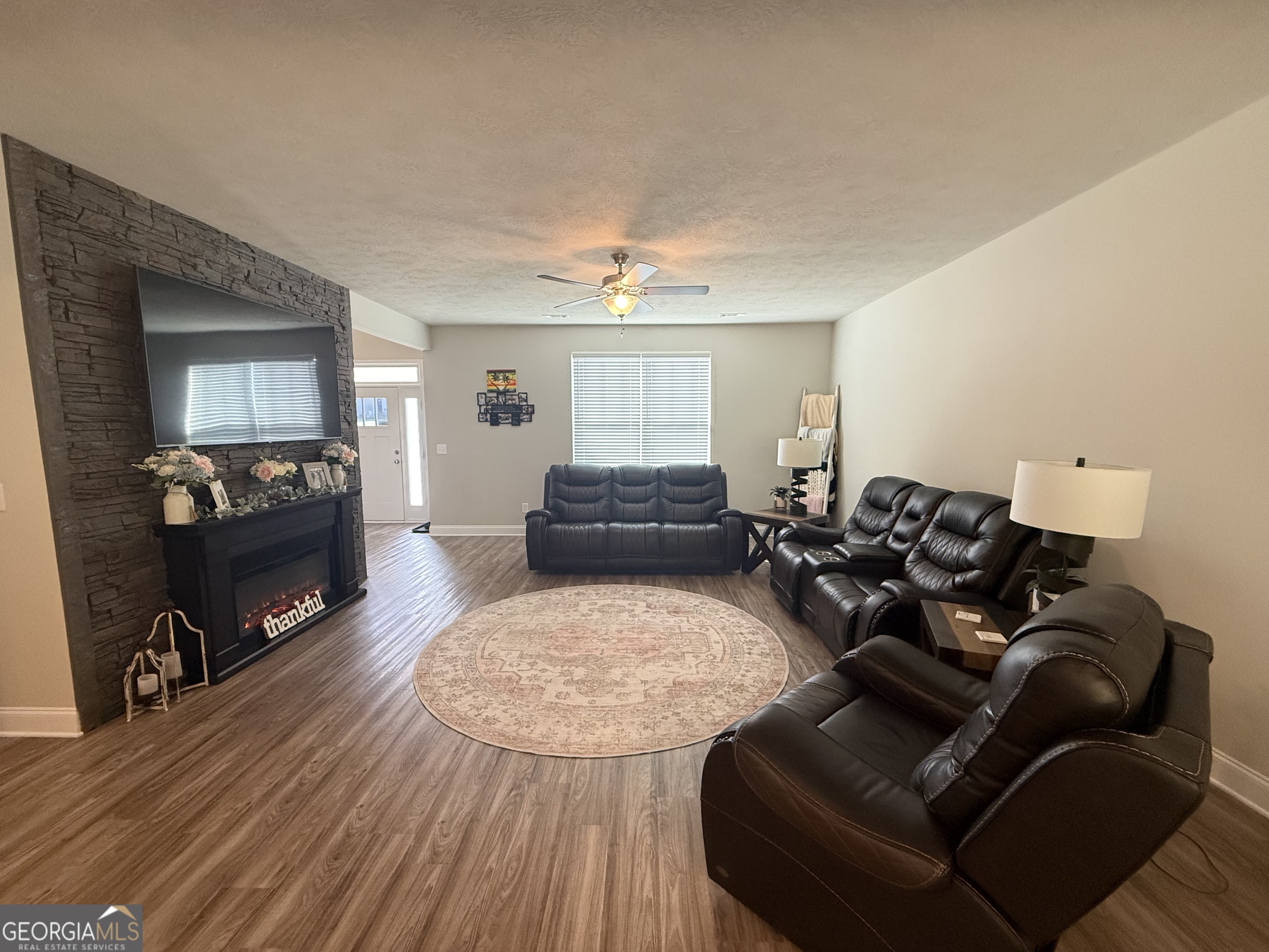136 Pebble Lane Harlem, GA 30814 - Photo 4 of 30 a living room with furniture and wooden floor