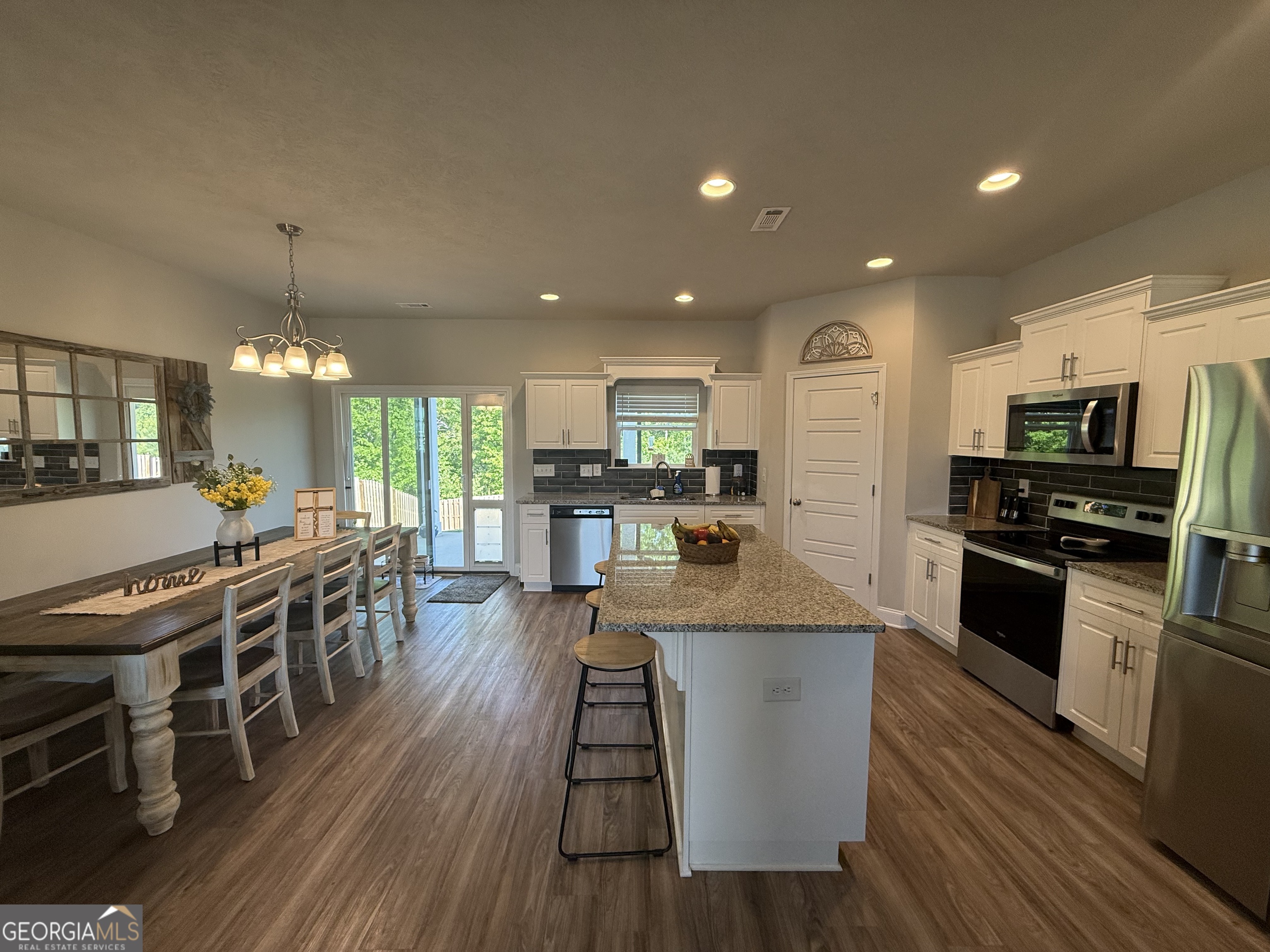 136 Pebble Lane Harlem, GA 30814 - Photo 6 of 30 a large kitchen with a table and chairs