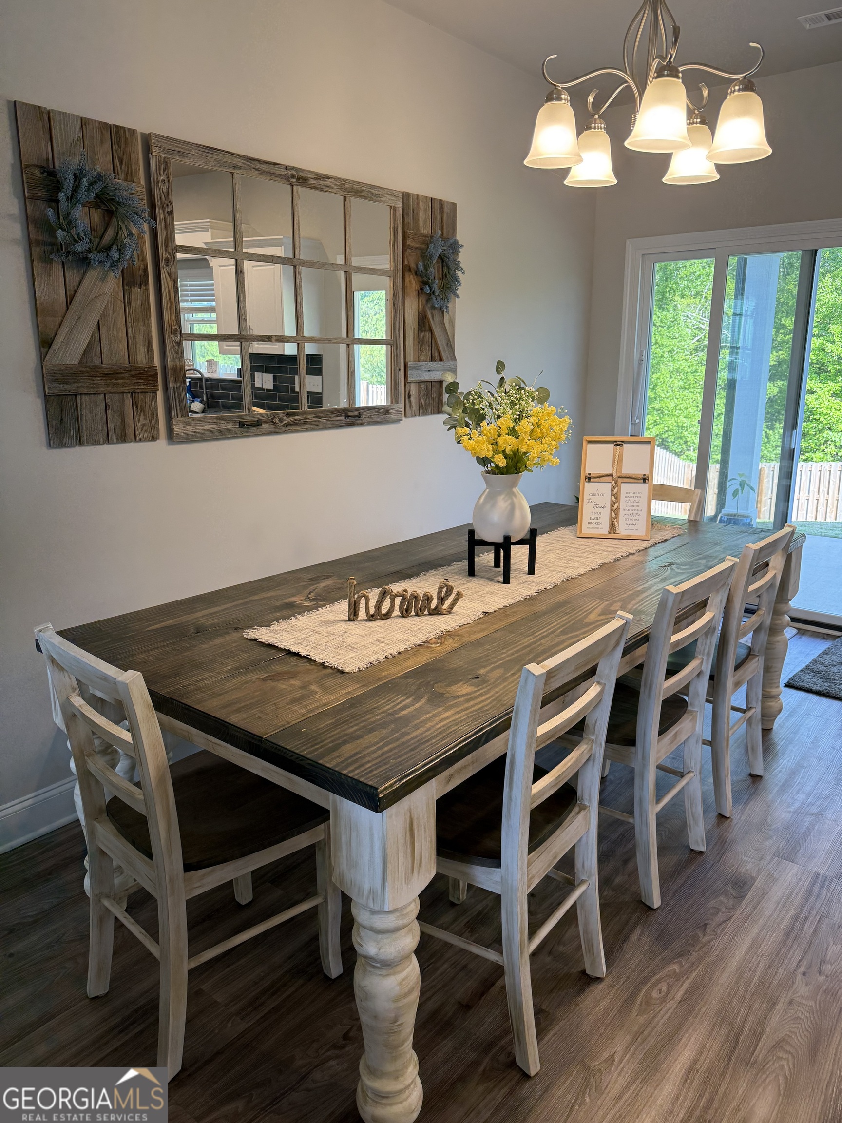 136 Pebble Lane Harlem, GA 30814 - Photo 7 of 30 a dining room with furniture a potted plant and wooden floor