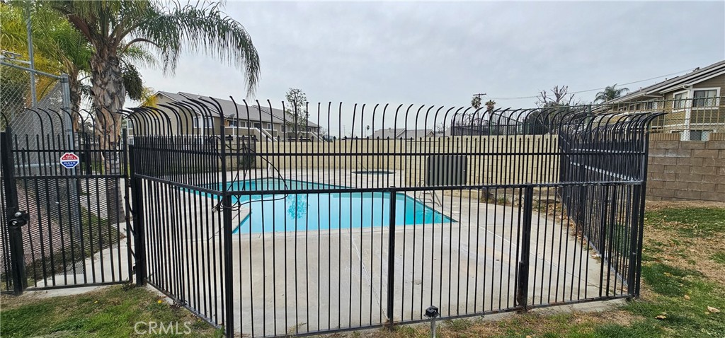 936 Fairway, Unit 23 Grand Terrace, CA 92324 - Photo 13 of 14 a view of a black gate