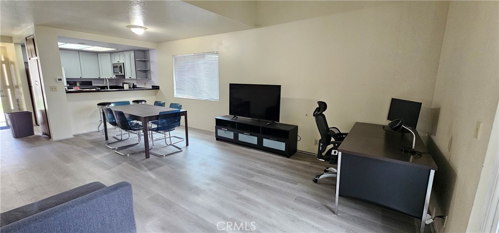 936 Fairway, Unit 23 Grand Terrace, CA 92324 - Photo 4 of 14 a living room with furniture and a flat screen tv