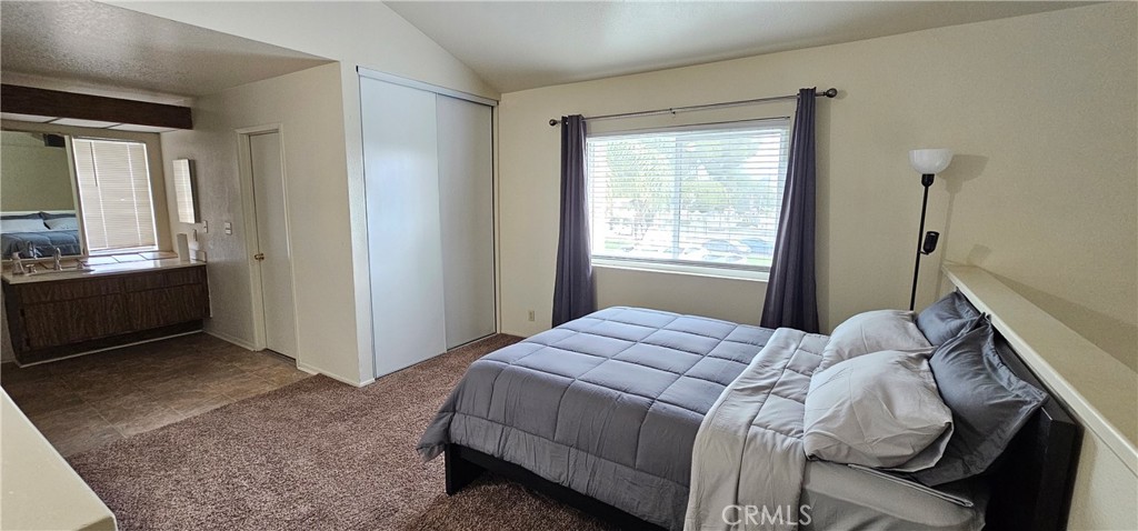936 Fairway, Unit 23 Grand Terrace, CA 92324 - Photo 5 of 14 a bedroom with a bed and a window