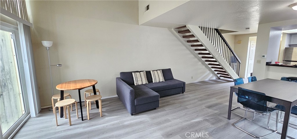 936 Fairway, Unit 23 Grand Terrace, CA 92324 - Photo 7 of 14 a living room with furniture and a chair