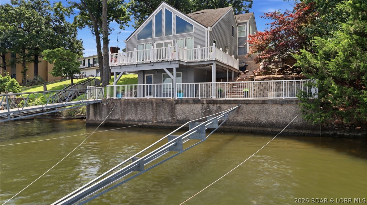 1069 Indian Hill Road Sunrise Beach, MO 65079 - Photo 2 of 54 Massive Deck Spaces for Easy Entertaining