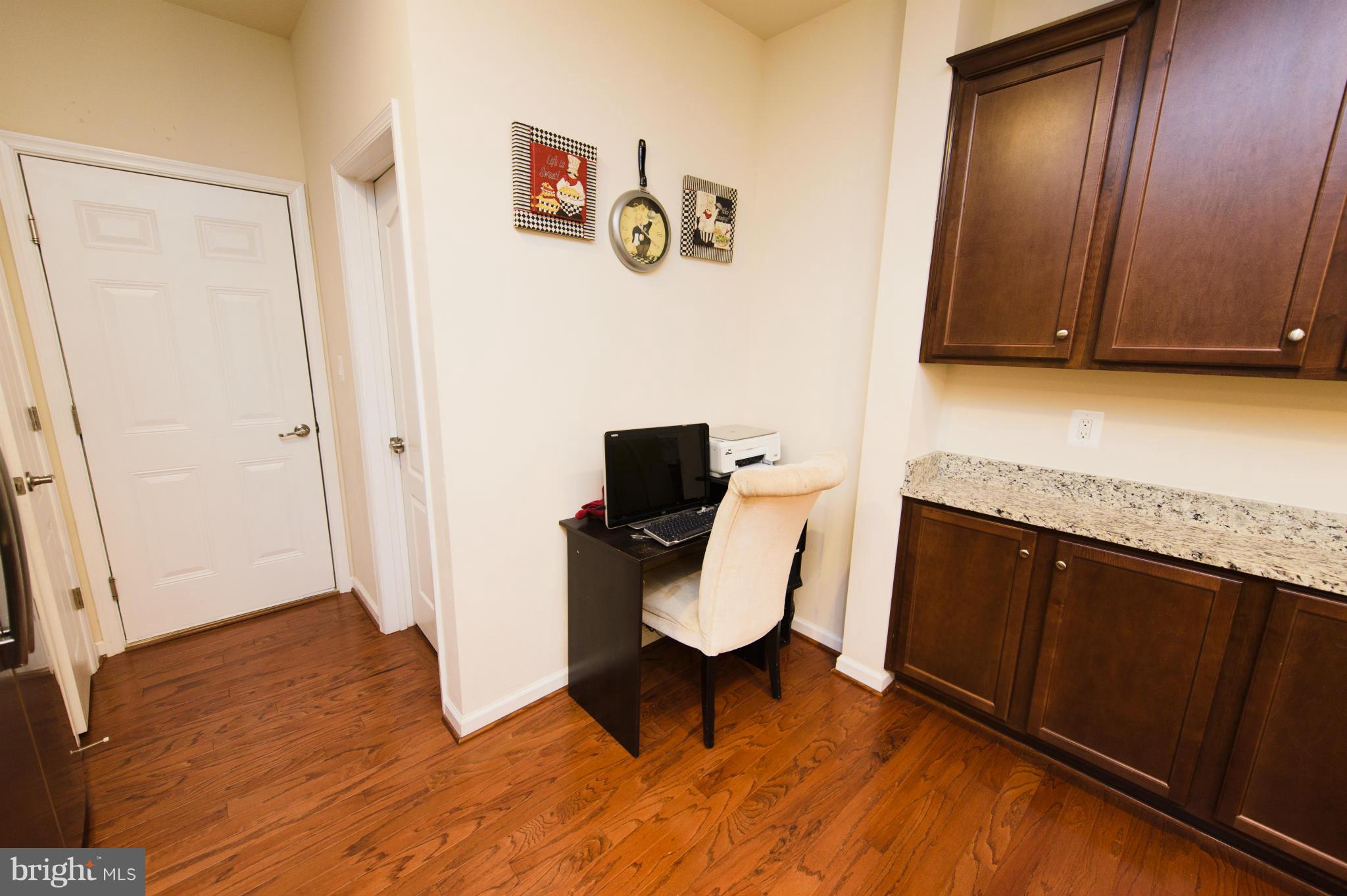 4878 Dane Ridge Circle, Unit 123 Woodbridge, VA 22193 - Photo 8 of 21 a view of a hardwood floor and wardrobe