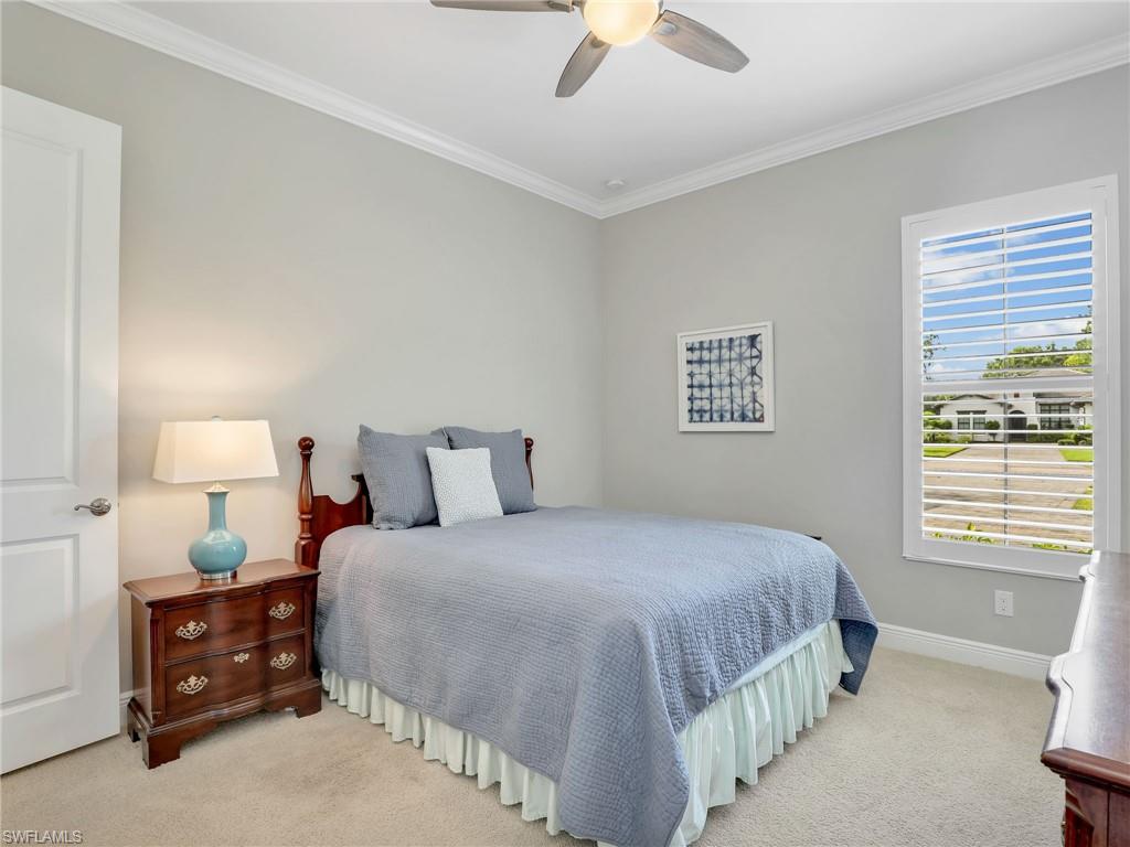 2079 Antigua Lane Naples, FL 34120 - Photo 37 of 44 Bedroom featuring ornamental molding, carpet flooring, and a ceiling fan