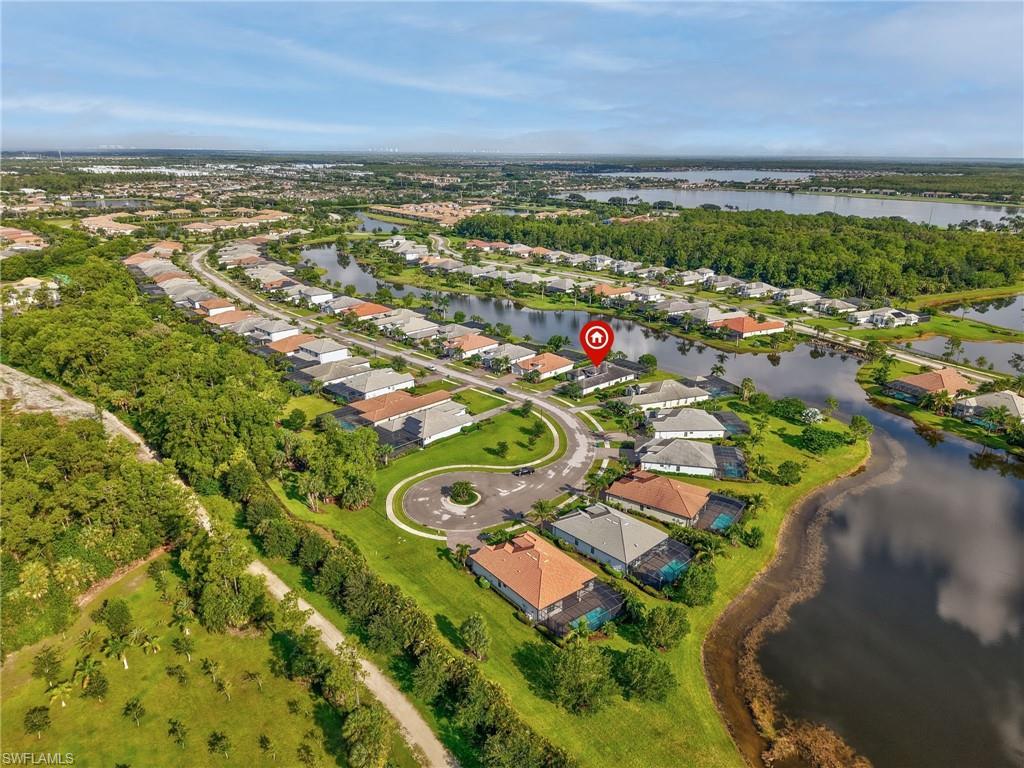 2079 Antigua Lane Naples, FL 34120 - Photo 40 of 44 Aerial view of property and surrounding area with nearby suburban area and a large body of water
