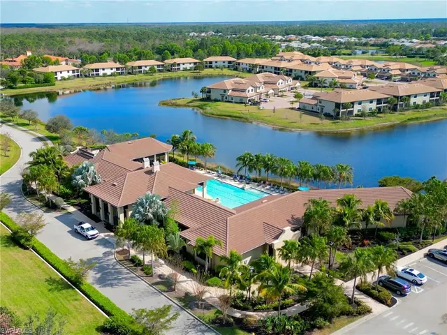 an aerial view of a house with a lake view